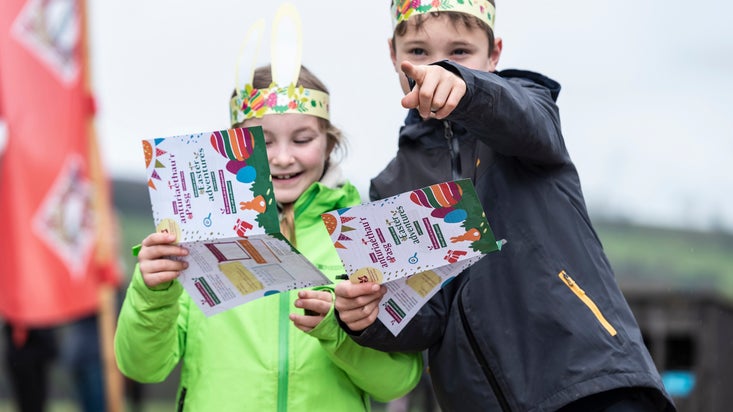 A family enjoying the Easter trail in the garden at Chirk Castle